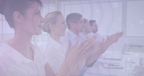 Business team applauding during corporate meeting