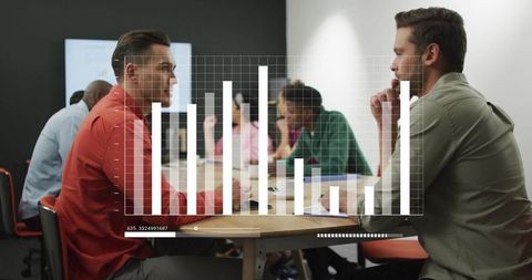 Professional Team Analyzing Data in Modern Office Environment