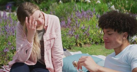 Young Couple Enjoying Relaxing Garden Picnic Together