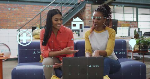 Women Analyzing Medical Data on Laptop for Healthcare Technology