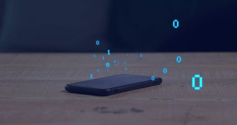 Holographic binary data rising from smartphone on rustic wooden desk with blue glow