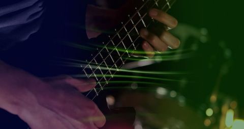 Glowing Green Light Trails with Hands Playing Electric Guitar - Download Free Stock Images Pikwizard.com