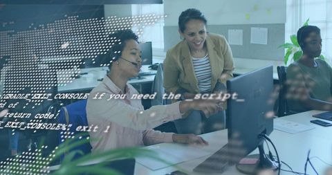 Diverse women working with digital data overlay in modern office