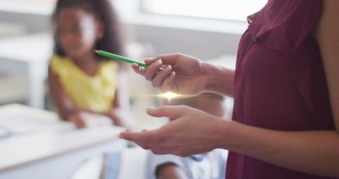 Light Trails Over Students with Teacher Promoting Learning