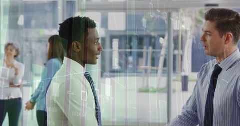 Multiracial businessmen discussing in modern office with financial graphics overlay