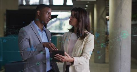 Corporate Professionals Networking with Digital Interface in Office