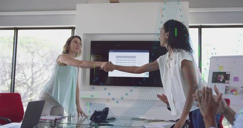 Diverse Business Team Discussing Financial Data in Modern Office