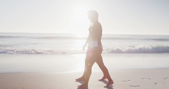 Women Enjoying Peaceful Beachwalk at Sunrise - Download Free Stock Images Pikwizard.com