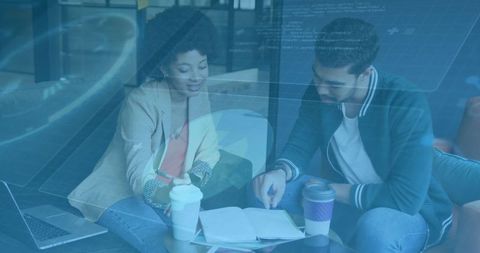 Professional colleagues collaborating in modern office lounge