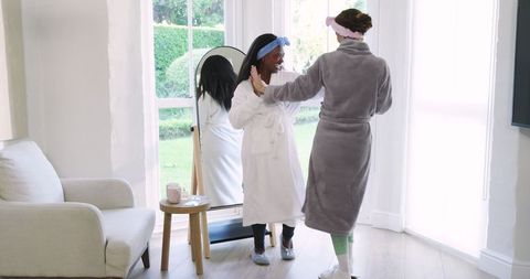 Diverse Female Friends Celebrating in Cozy Living Room