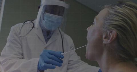 Healthcare worker performing throat swab test in clinical environment