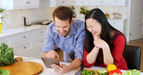 Couple Joyfully Creating New Recipes with Fresh Ingredients - Download Free Stock Images Pikwizard.com