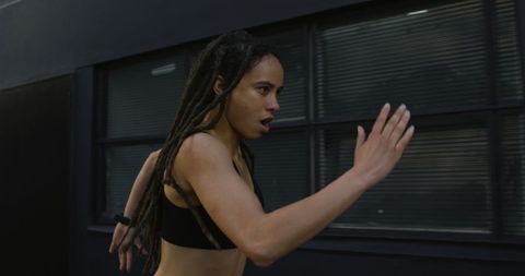 Athletic Woman Jogging in Urban Environment for Fitness