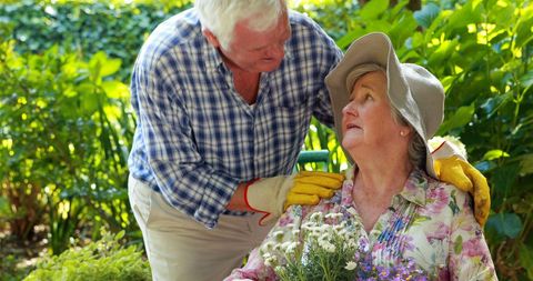 Happy Elderly Couple Gardening and Connecting Outdoors