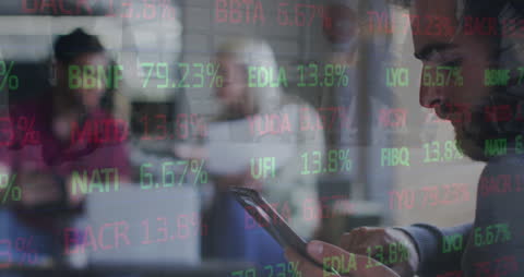 Caucasian Man Analyzing Digital Stock Market Trends on Tablet in Modern Office
