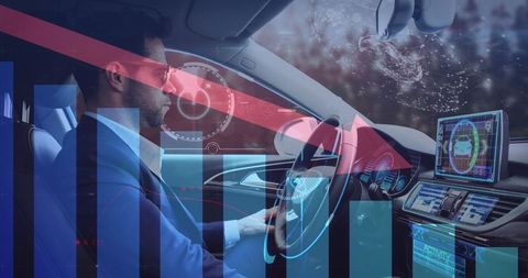 Businessman engages with high-tech interface in self-driving car