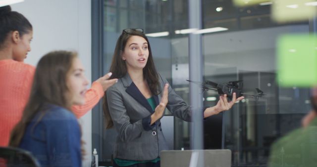 Team Discussing Drone Project in Modern Office Environment - Download Free Stock Images Pikwizard.com