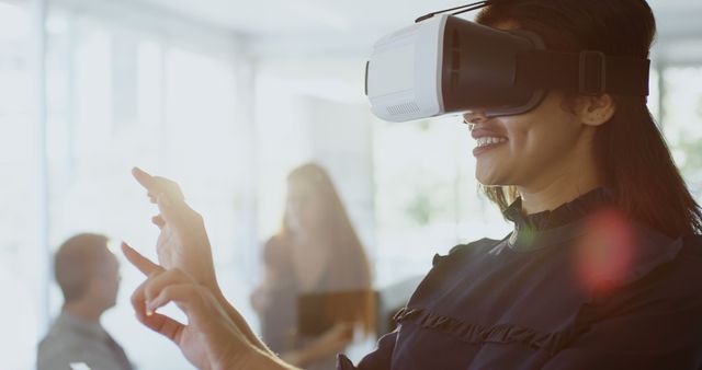 Woman Experiencing Virtual Reality in Modern Office Environment - Download Free Stock Images Pikwizard.com