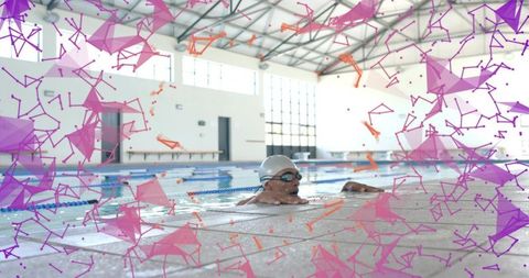 Male swimmer resting at pool edge while grasping ledge with vibrant geometric overlay
