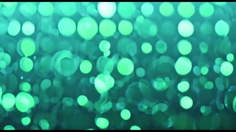 Dynamic Green Spot Bokeh in Motion