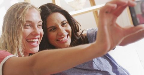 Joyful Friends Relaxing and Taking a Selfie at Home