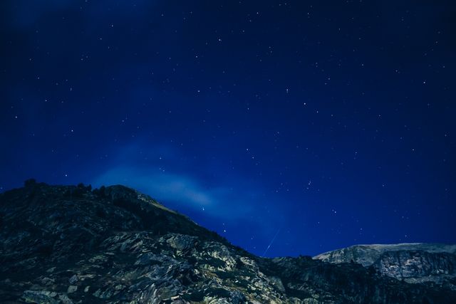 Beautiful view of mountains and shining stars in the night sky. nature and ecology concept