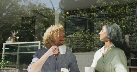 Happy Couple Enjoying Coffee at Modern Cafe Outdoor Seating