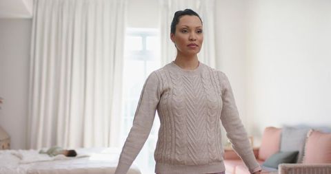 Mother Monitoring Infant in Cozy Bedroom Setting