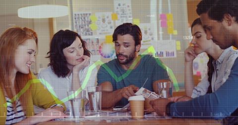 Diverse Team Analyzing Financial Data in Office Meeting