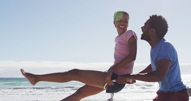 Cheerful Couple Riding Bicycle on Sunny Beach Day - Download Free Stock Images Pikwizard.com