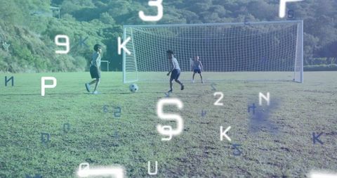 Youthful Energy: Boys Playing Soccer on Outdoor Field
