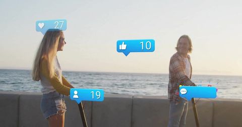 Young Couple Riding E-Scooters with Prime Views Near Seaside at Dusk