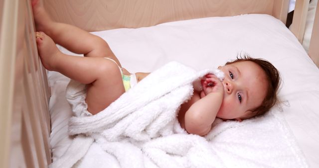 Cute Baby Relaxing in Crib with Cosy Blanket - Download Free Stock Images Pikwizard.com