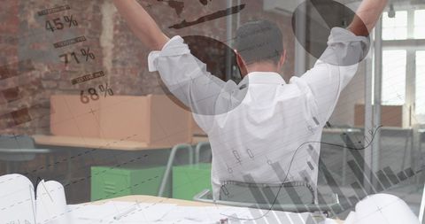 Businessman stretching in office with graphs overlay