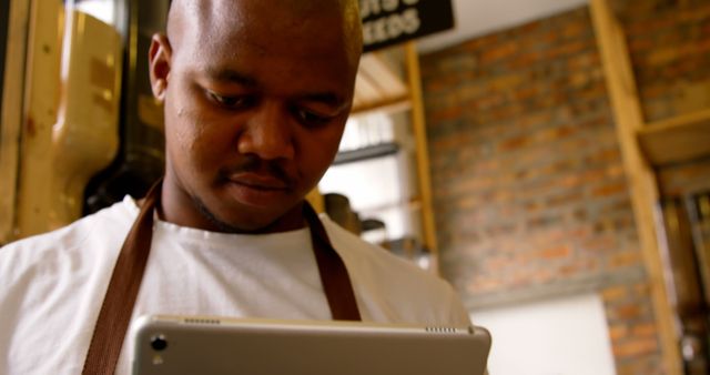 African American Barista Using Digital Tablet in Coffee Shop - Download Free Stock Images Pikwizard.com