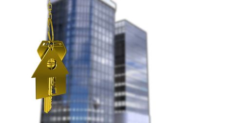 Golden house keychain concept over urban skyscrapers