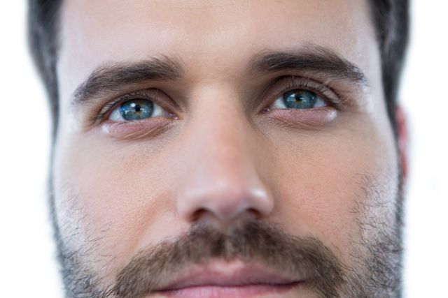 Close-Up of Man with Green Eyes and Beard - Download Free Stock Photos Pikwizard.com