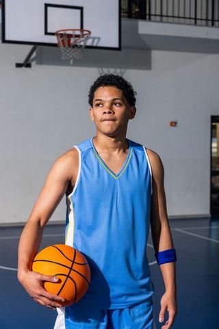 Confidence on the Court: Teenage Basketball Player Focused for Game