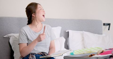 Woman smiling numbering signals travel readiness
