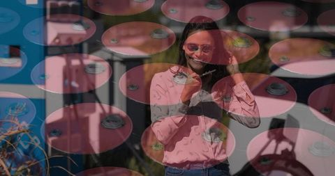 Abstract composition with woman on smartphone and industrial barrels