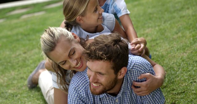 Happy Family Stacked Together Enjoying Outdoor Playtime - Download Free Stock Images Pikwizard.com