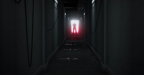 Silhouetted Figure at End of Mysterious Corridor