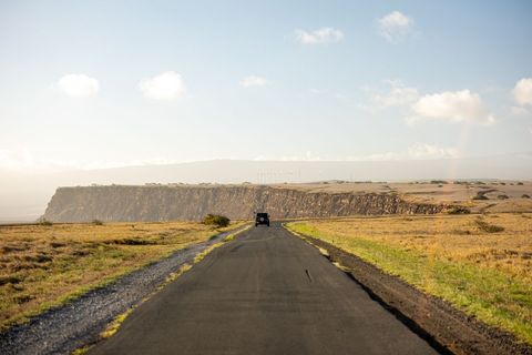 Solitary Journey on Scenic Coastal Road at Sunset