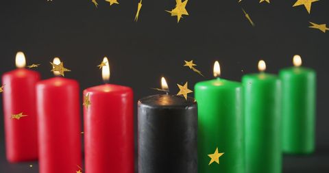 Kwanzaa Candles Illuminating Against Starry Backdrop