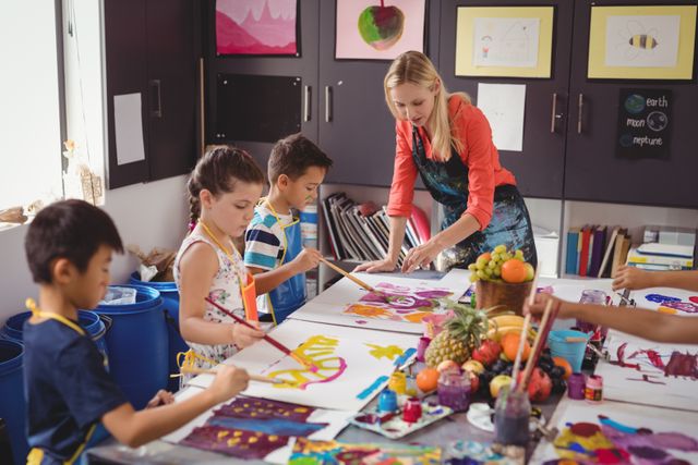 Teacher Assisting Children in Art Class - Download Free Stock Photos Pikwizard.com