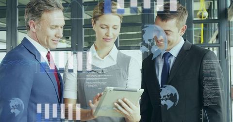 Business Team Analyzing Digital Data with Tablet in Modern Office