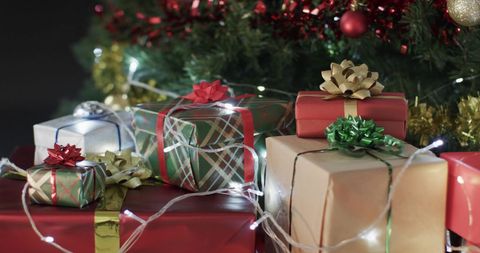 Festive Wrapped Gifts Under Decorated Christmas Tree - Download Free Stock Images Pikwizard.com