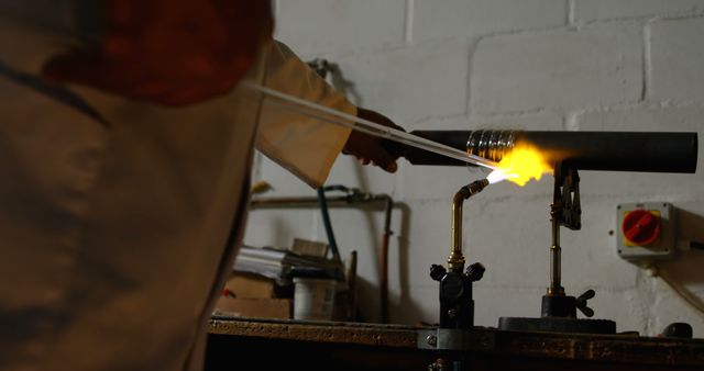 Glassworker Heating Rods in Workshop - Download Free Stock Images Pikwizard.com