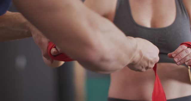 Boxing Trainer Wrapping Hands of Female Boxer in Gym - Download Free Stock Images Pikwizard.com