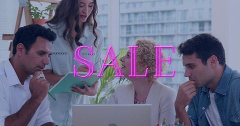 Marketing team brainstorming at laptop with neon sale overlay for retail campaign
